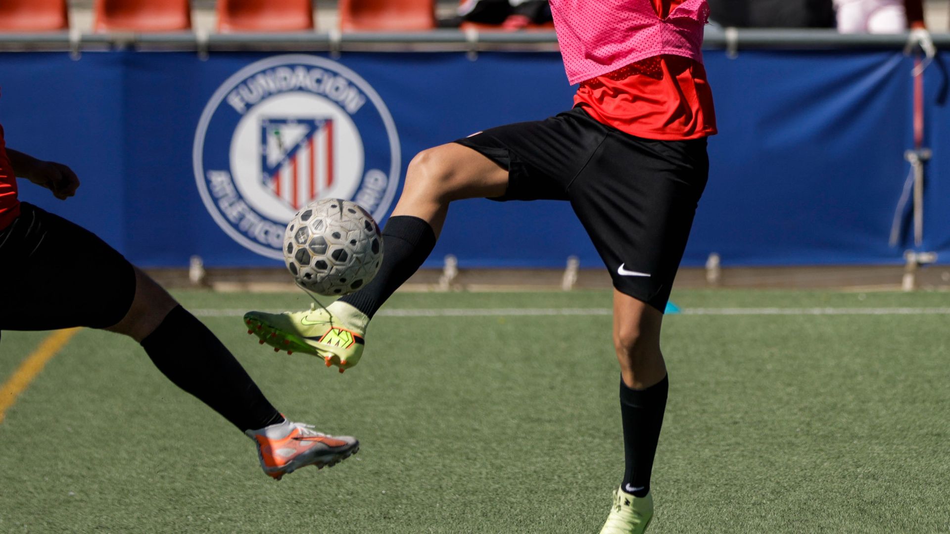Players controlling the ball during an Atlético Academy training session