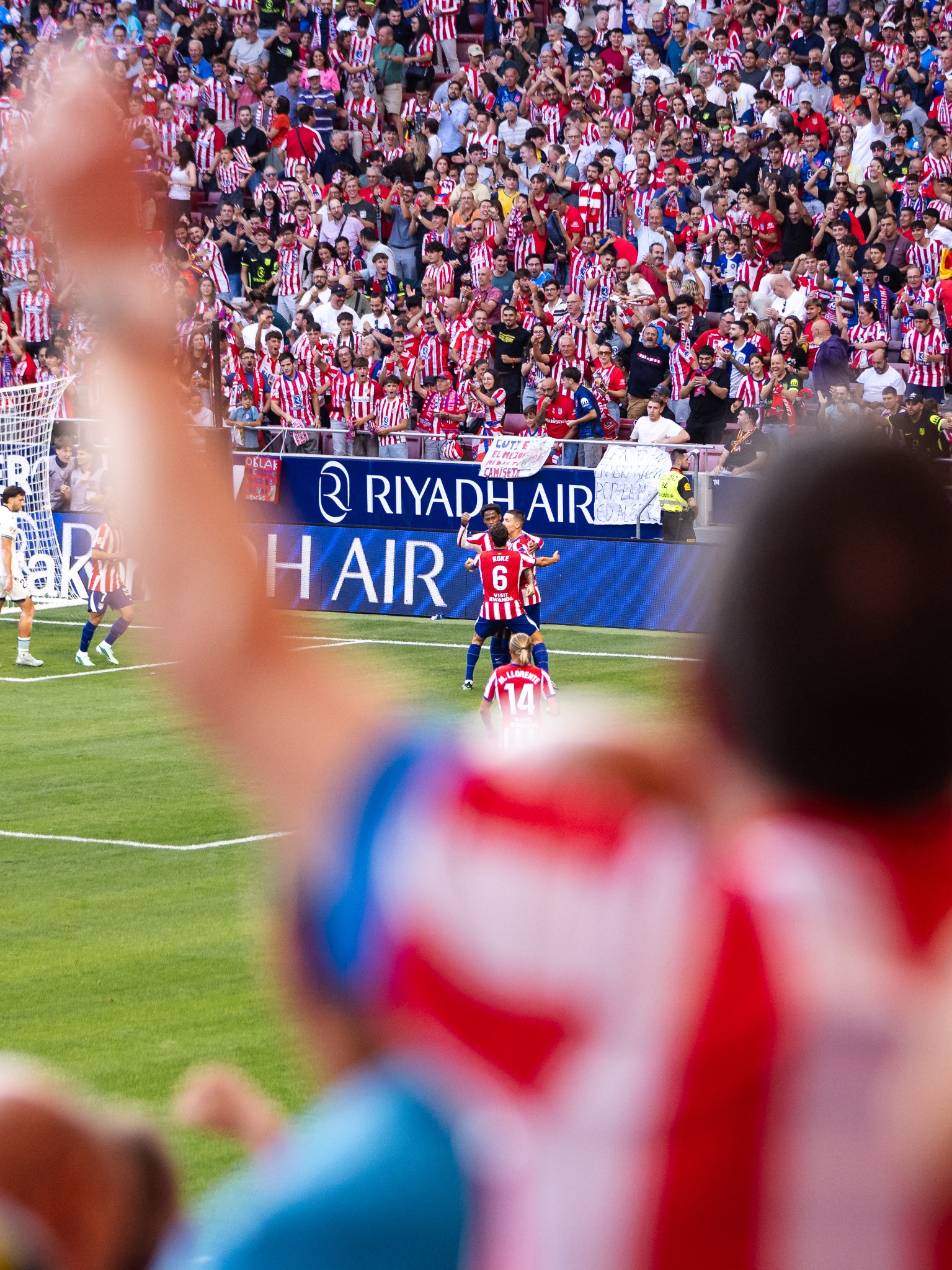 Supporters and Atlético players celebrating inside the stadium