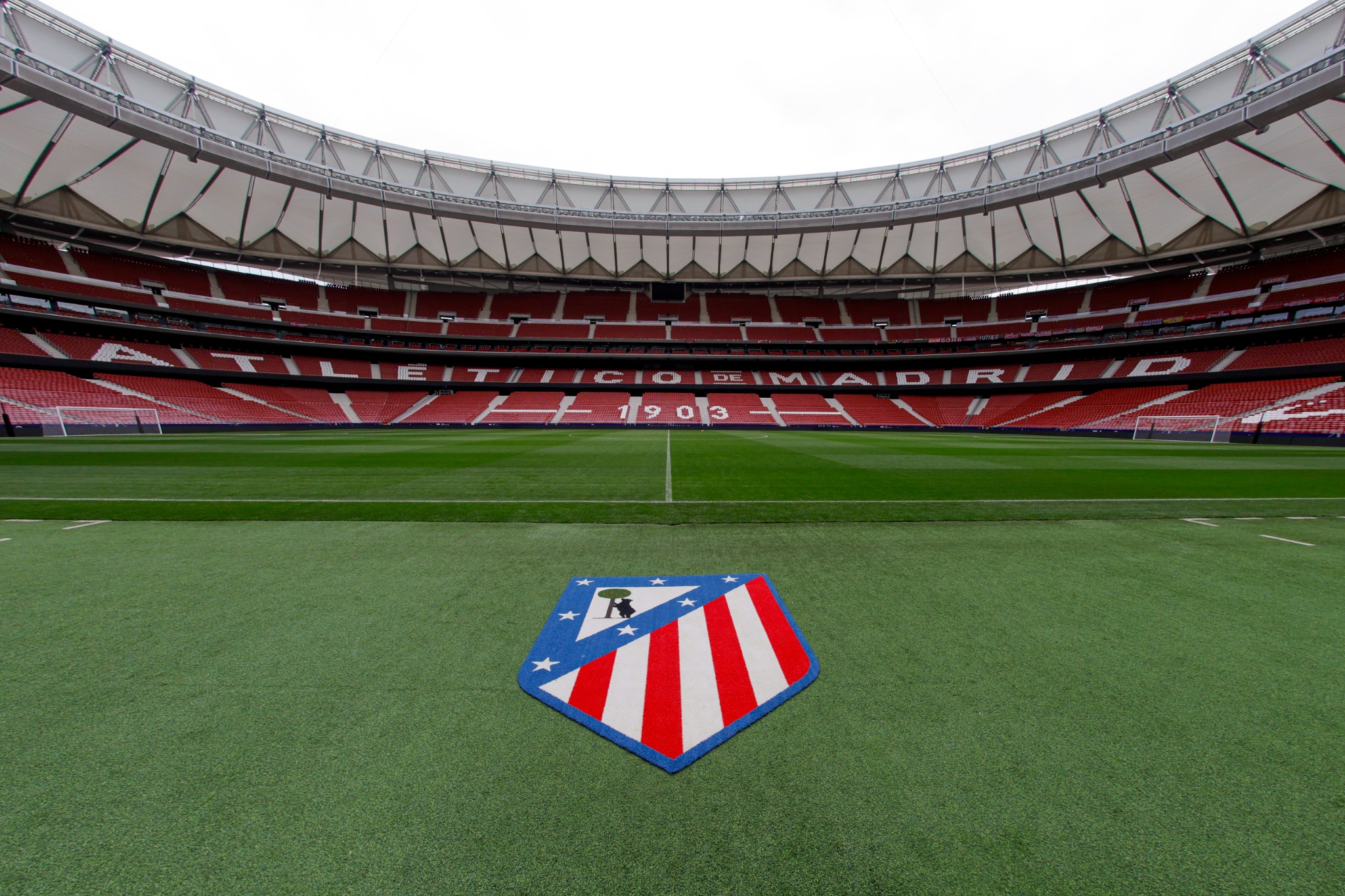 The Atlético crest beside the pitch inside Riyadh Air Metropolitano stadium